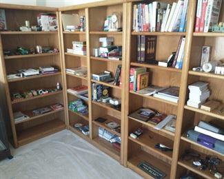  3 Bookcases for sale - One single and two dual bookcases. Most items on the shelves are $1.00