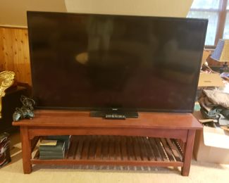 60"Samsung TV and bench 