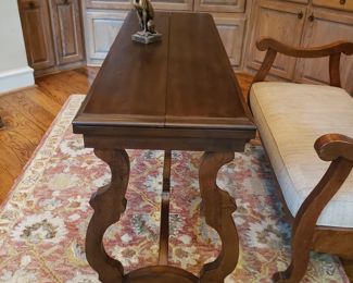 Table w leaves that fold up onto top of table for entry table