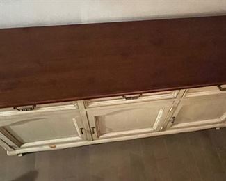 MAKE OFFER.  ALL OFFERS CONSIDERED.  $1000 USD      French Country Distressed White Arch Door Buffet Sideboard Credenza LA178-35    A French painted sideboard cabinet from the mid 20th century. This mid-century cabinet from Italy, features a rectangular-shaped dark wood top with overhanging, molded edge, atop a case which houses three panel-front drawers set horizontally. Each door is arch-shaped and open to reveal a shelf and plentiful storage within. This piece has a white wash which still shows much of the natural wood grain. This mid 20th century French console cabinet, with it's great length and storage potential, would work well in a dining or kitchen area as a buffet, or perhaps as a nice storage piece for a family room.
Dimensions: 69.5 x 20 x 36"H
Condition: Very good
Local pick up Potomac, MD.  Contact us for shipper suggestions     https://goodbyhello.com/products/french-country-distressed-wht-arched-door-buffet-sideboard-credenza-la178-35?_pos=8&_sid=f4cf1db7b&_ss=r