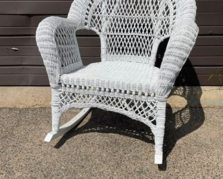 $900 USD      Vintage White Rocker Shelves & End Table/Floor Stand GH-3     Borrowing design inspiration from 1930s Eastern coastal designs the beautiful rocker makes an elegant and stylish addition to any backyard patio decor.  The set is in the Bar Harbor style with an open weave pattern as well as tight weave. 

The floor stand features classic ornamentation. Two upper shelves are open at the front with sides and back featuring crossover stick rattan spindling and braided trim. The open framework also incorporates gallery railing at the top to support books or collectibles. Below, hinged double doors with woven panels and wrapped knobs conceal a single interior shelf, making this freestanding unit a quaint nightstand for guest or children's bedrooms. In living areas or a powder room, it offers discreet storage as well as a place to keep favorite items on display.

See our tri-mirror complimentary vanity.

Condition:  Very good for age.  There are a few areas beginning to unravel but