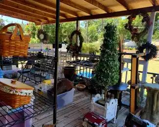 Covered Patio Full! Tree. Pottery. Longberger baskets. Statues. Tools. Wreaths. Patio Furniture.