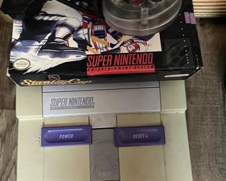 Vintage Super Nintendo and controllers, games