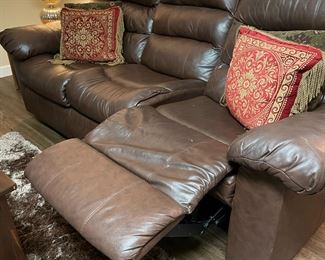Brown leather sofa recliner and wood coffee and side tables