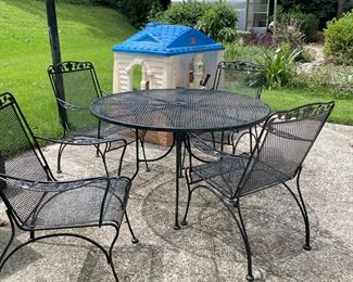 iron patio set and children's playhouse