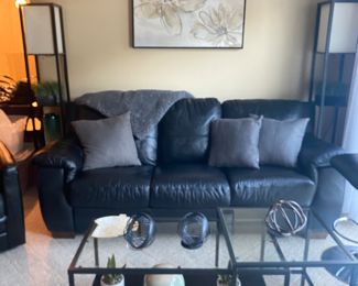 nesting coffee table and black leather sofa