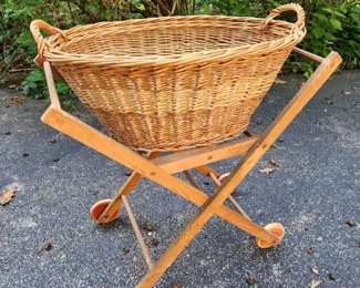 Antique laundry basket with folding  stand.
