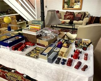 Lots of fun on this table.  Comics, books, wind-ups, magic tricks, race cars....