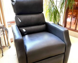 Like new grey leather rocker/recliner
