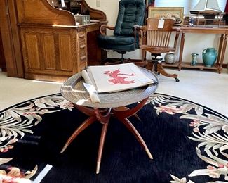 Mid century spider-leg table with brass top, temple rubbings, large round rug
