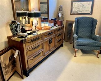 The long dresser and two mirrors. Vintage candlestick lamp, jewelry, folding Japanese screen, wingback chair.