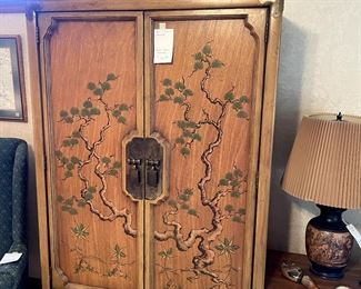 The armoire is the only piece that has the applied design. 