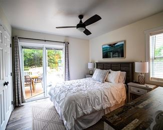Beautiful master bedroom suite with queen bed; two nightstands & tall dresser. Great ceiling fan!
