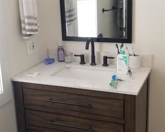 Updated bath vanity; great mirror & light