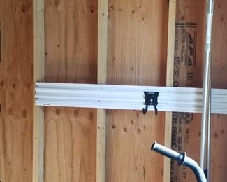 Nearly new 16' x 20' shed features upgraded rack/hanging system