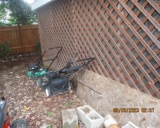 several lawn mowers