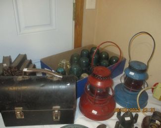 Old kerosene lamps, lunch bucket, transformers,