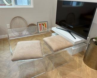Mid century swivel ottomans, acrylic CB2 coffee table, white gloss tv stand
