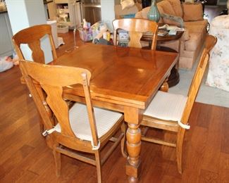oak draw-leaf table and four chairs, nice cushions