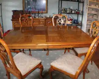 Thomasville dining table and six matching chairs, plus two leaves. Two more similar armchairs with matching upholstery available.