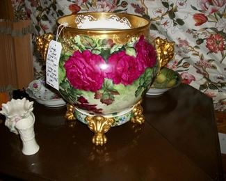 Incredible large hand-painted Limoge pot with elephant head handles and decorative stand, 13.5 in tall, signed by the artist.