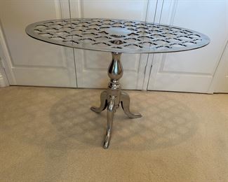 Oval top metal side table end table measures 19 by 31 inches on top and 22 high