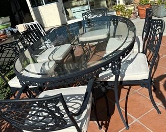 Brown Jordan patio set table with six chairs, sumbrella cushions, umbrella center hole, top is 47” by71”