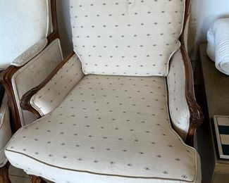 Down cushion arm chair needs tiny clean on seat cushion, is 28” wide and 35” deep with carved details in wood frame