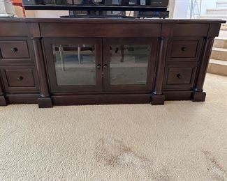 Large long media cabinet measures 78 inches wide, 24 deep and 29 high, beveled glass center doors for all components, and storage drawers on sides