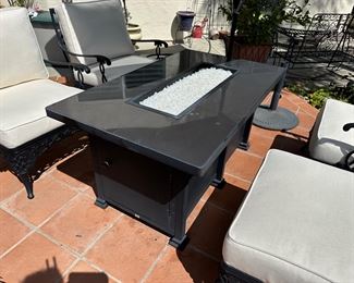 The Fire Pit!  O.W. Lee Santorini model #51-09 retails for $3,490. The focal point of any patio, doubles as a table for your beverages, glass all cleaned for you, and owner was kind enough to add propane to the tank for you to try it out. 