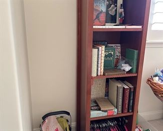 Narrow 4 high wood shelf  is 21” wide, 15 deep and 63” tall, felt hangers, books, 