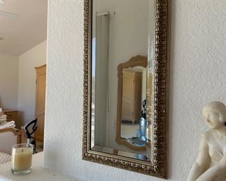 Oblong beveled mirror to reflect your happy face about the bargains!