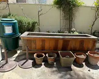 Tumbleweed garden composter is 22 inch diameter by 48 inches tall, wood planter is 95 inches wide, 28 deep and 28 inches tall, on super expensive wheels, custom made, two more bases since two come with umbrellas, assorted terra cotta pots