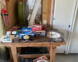 Garage table, electric supplies, two glass wall shelves in box, wreath holders, 