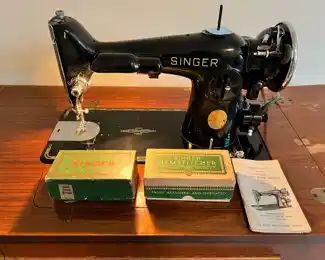 Vintage Singer Sewing Machine No. 201-2 with original Singer Sewing Cabinet.  The sewing machine is in good working condition