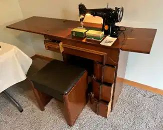 Vintage Singer Sewing Machine No. 201-2 with original Singer Sewing Cabinet.  The sewing machine is in good working condition