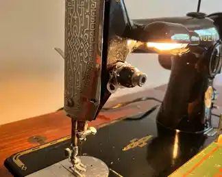 Vintage Singer Sewing Machine No. 201-2 with original Singer Sewing Cabinet.  The sewing machine is in good working condition