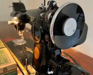 Vintage Singer Sewing Machine No. 201-2 with original Singer Sewing Cabinet.  The sewing machine is in good working condition