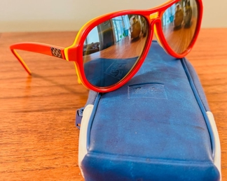 Vintage Ray-Ban Vagabond Sunglasses in rare Red-Orange-Yellow color combo.  This pair features the Olympic Rings as they were issued right after the US Olympic Committee selected Ray-Ban to outfit US Olympians & comes with original case and info cloth