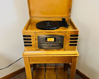 Crosley Radio/Record/CD/Cassette player with vinyl record storage stand
