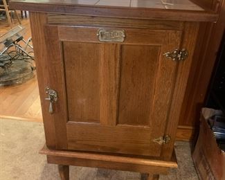 #26	White Clad Simmons hardware Repro Ice Box on Stand rolling w/tile top - 24x24x37	 $125.00 			
