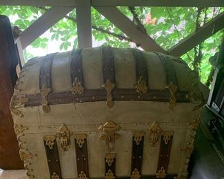 #50	Greenish/Gold Painted Camel Back Trunk  - 33x21x31 - on wheels (2 wheels missing - handles)	 $100.00 			
