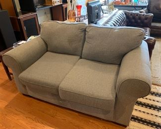 #96	Blue loveseat sofa with attached back cushion	 $65.00 			
