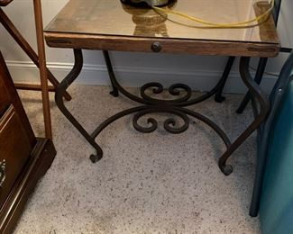 #122	iron base wood and glass top  24x20x23	 $80.00 			
