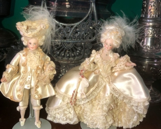 Porcelain miniature dolls hand made by an artisan in the world of scale miniature dolls. 1” = 1’. Dolls about 5”, 6”. Presumably bought at one of the doll shows in central Florida, as the owner belonged to an Orlando doll club.