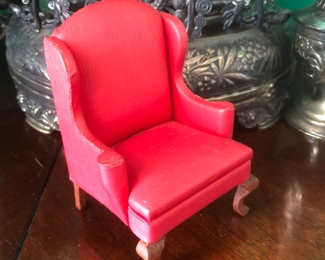 A scale dollhouse chair