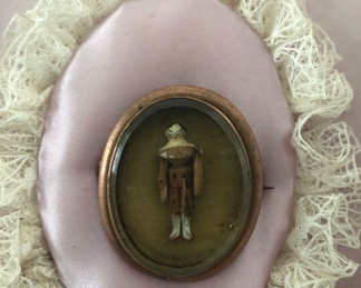 Close up of tiny wood carved man