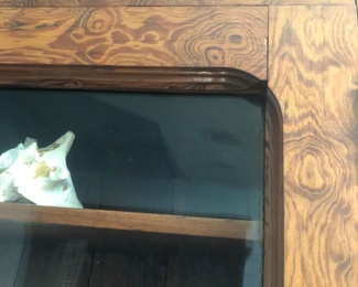 Close up of wood detail on cabinet.