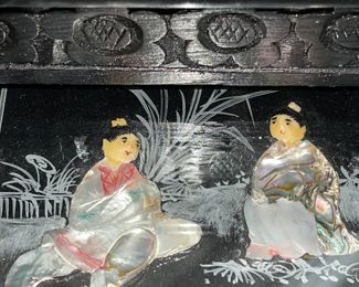 Detail pic, Asian Art nesting table set with glass tops. Black Lacquer Ebony wood with Mother of Pearl shell accents. Hand painted.