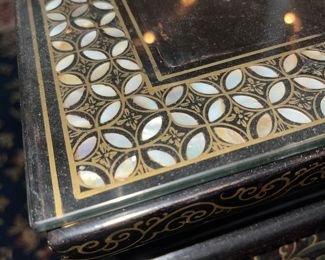 Detail pic, Asian Art Coffee table, glass top. Black Lacquer Ebony wood with Mother of Pearl shell accents. Hand painted.